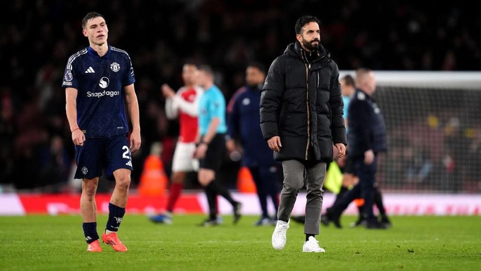 Manchester United manager Ruben Amorim and Manuel Ugarte after the final whistle of the Premier League match at the Emirates Stadium, London. Picture date: Wednesday December 4, 2024. (Photo by John Walton/PA Images via Getty Images)