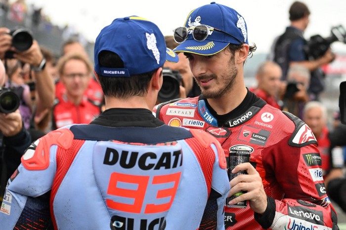 Ducati Lenovo Team rider Francesco Bagnaia of Italy (R) is congraturated by Gresini Racing MotoGP rider Marc Marquez of Spain after the end of the sprint race of the MotoGP Japanese Grand Prix at the Mobility Resort Motegi in Motegi, Tochigi prefecture on October 5, 2024. (Photo by Toshifumi KITAMURA / AFP)