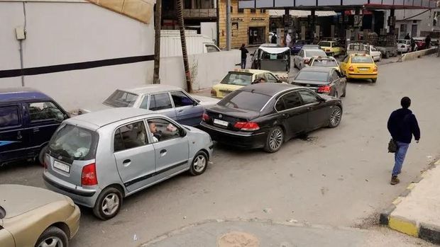 People queue as they wait to fuel up at a gas station, after anti-government forces took the main northern city of Aleppo and have since pushed south from their enclave in northwest Syria on December 4, 2024. (Reuters)