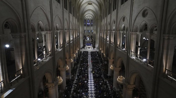 Clergymen leave after the first public mass in Notre Dame Cathedral since the 2019 fire, Sunday, Dec. 8, 2024 in Paris. (AP Photo/Michel Euler)