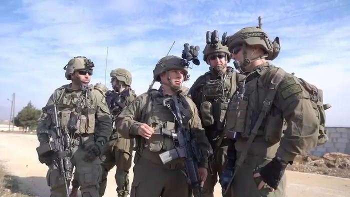 Israeli soldiers operate in a location given as Southern Syria, in this screengrab from a video obtained by Reuters on December 9, 2024. (Reuters)