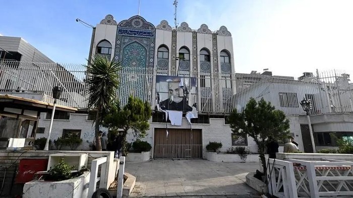 A picture taken in Damascus on December 9, 2024 shows the building of the Iranian embassy which was ransacked after the opposition took the Syrian capital the previous day, with a portrait of Iran’s slain Revolutionary Guards commander Qasem Soleimani, still hanging on its fence. (AFP)