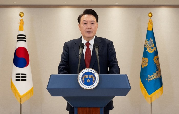 Presiden Korsel Yoon Suk Yeol This handout photo taken on December 12, 2024 and released by the South Korean Presidential Office via Yonhap shows South Korean President Yoon Suk Yeol delivering an address at the Presidential Office in Seoul. South Korean President Yoon Suk Yeol on December 12, vowed to fight until the very last minute, defending his shock decision last week to declare martial law and deploy troops to the countrys parliament. (Photo by Handout / South Korean Presidential Office via Yonhap / AFP) / - South Korea OUT / RESTRICTED TO EDITORIAL USE - MANDATORY CREDIT AFP PHOTO / SOUTH KOREAN PRESIDENTIAL OFFICE VIA YONHAP - NO MARKETING NO ADVERTISING CAMPAIGNS - DISTRIBUTED AS A SERVICE TO CLIENTS