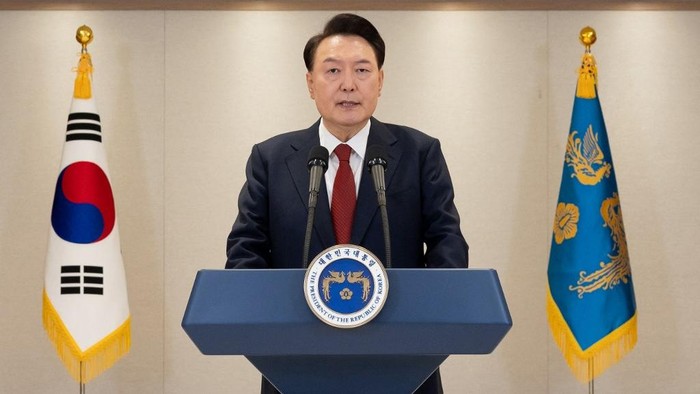 This handout photo taken on December 12, 2024 and released by the South Korean Presidential Office via Yonhap shows South Korean President Yoon Suk Yeol delivering an address at the Presidential Office in Seoul. South Korean President Yoon Suk Yeol on December 12, vowed to fight until the very last minute, defending his shock decision last week to declare martial law and deploy troops to the countrys parliament. (Photo by Handout / South Korean Presidential Office via Yonhap / AFP) / - South Korea OUT / RESTRICTED TO EDITORIAL USE - MANDATORY CREDIT AFP PHOTO / SOUTH KOREAN PRESIDENTIAL OFFICE VIA YONHAP - NO MARKETING NO ADVERTISING CAMPAIGNS - DISTRIBUTED AS A SERVICE TO CLIENTS