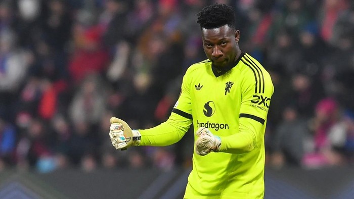 Manchester Uniteds Cameroonian goalkeeper #24 Andre Onana celebrates his teams first goal during the UEFA Europa League football match between Viktoria Plzen and Manchester United in Plzen, Czech Republic on December 12, 2024. (Photo by Michal Cizek / AFP)