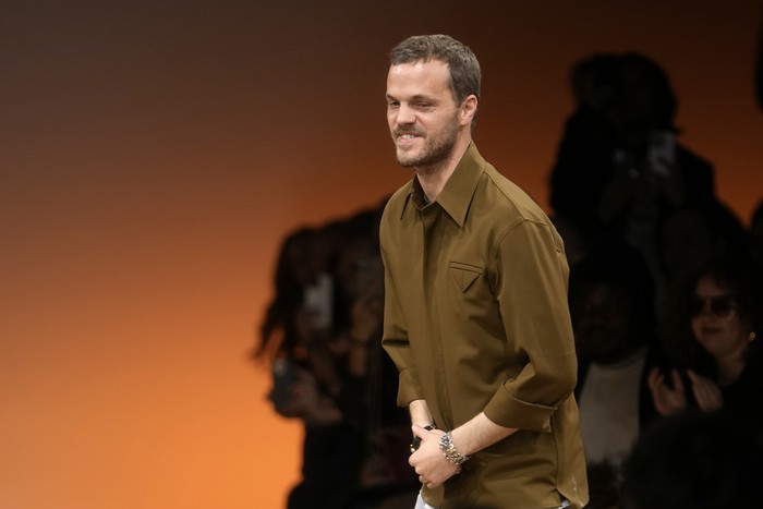 FILE - Creative director Matthieu Blazy accepts applause after the conclusion of the Bottega Veneta womens Fall-Winter 2024-25 collection presented in Milan, Italy, Feb. 24, 2024. (AP Photo/Luca Bruno, file)