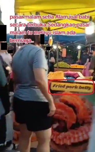 Muslim Woman Protests Pork Sales at Malaysian Night Market