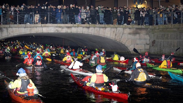 People attend the Santa Lucia kayak procession in Copenhagen Harbour, Sweden, December 13, 2024. Ritzau Scanpix/Thomas Traasdahl/via REUTERS    ATTENTION EDITORS - THIS IMAGE WAS PROVIDED BY A THIRD PARTY. DENMARK OUT. NO COMMERCIAL OR EDITORIAL SALES IN DENMARK.