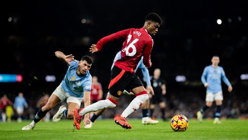 MANCHESTER, ENGLAND - DECEMBER 15: Amad Diallo of Manchester United in action during the Premier League match between Manchester City FC and Manchester United FC at Etihad Stadium on December 15, 2024 in Manchester, England. (Photo by Ash Donelon/Manchester United via Getty Images)