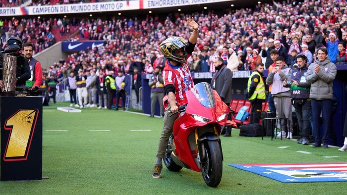 MADRID, SPAIN - DECEMBER 15: Jorge Martin presents the MotoGP World Championship Trophy prior to the LaLiga EA Sports match between Atletico de Madrid and Getafe CF at Riyadh Air Metropolitano on December 15, 2024 in Madrid, Spain. (Photo by Angel Martinez/Getty Images)