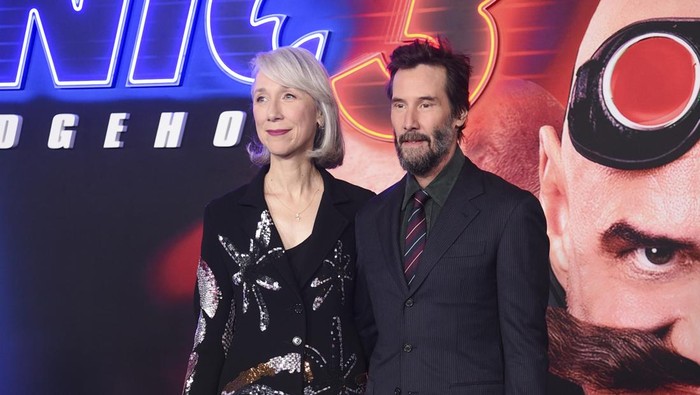 Alexandra Grant, left, and Keanu Reeves arrive at the premiere of Sonic The Hedgehog 3 on Monday, Dec. 16, 2024, at TCL Chinese Theatre in Los Angeles. (Photo by Richard Shotwell/Invision/AP)