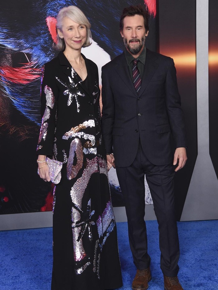 Alexandra Grant, left, and Keanu Reeves arrive at the premiere of 