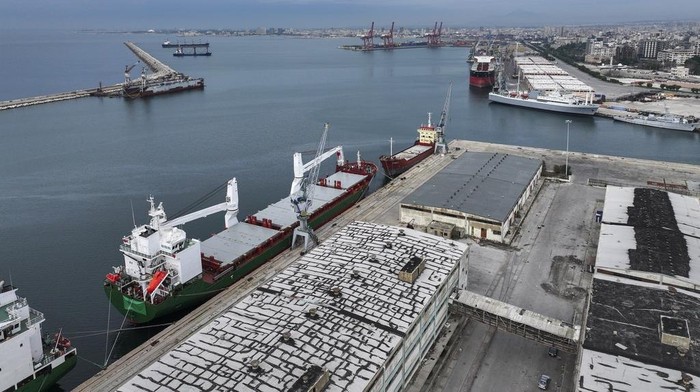 An aerial view shows containers at the seaport of Latakia in the Mediterranean Sea after it partially resumed operations following the ousting of the Assad regime, in Latakia, Syria, Monday, Dec. 16, 2024. (AP Photo/Ghaith Alsayed)