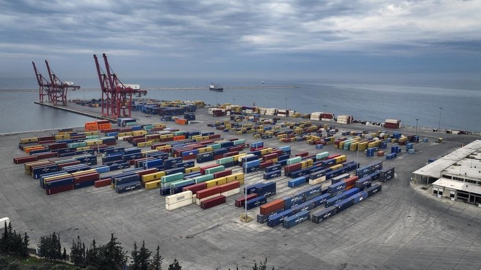 An aerial view shows containers at the seaport of Latakia in the Mediterranean Sea after it partially resumed operations following the ousting of the Assad regime, in Latakia, Syria, Monday, Dec. 16, 2024. (AP Photo/Ghaith Alsayed)
