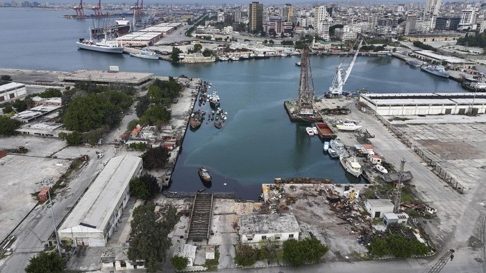 An aerial view shows containers at the seaport of Latakia in the Mediterranean Sea after it partially resumed operations following the ousting of the Assad regime, in Latakia, Syria, Monday, Dec. 16, 2024. (AP Photo/Ghaith Alsayed)