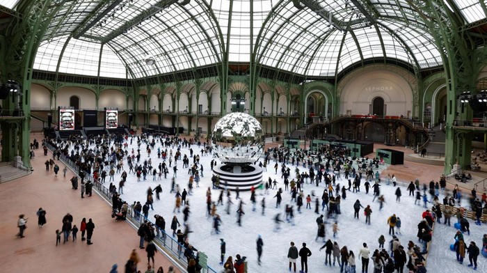 People skate on an indoor ice rink at the Grand Palais exhibition hall as part of Christmas holiday season in Paris, France, December 14, 2024. REUTERS/Stephanie Lecocq