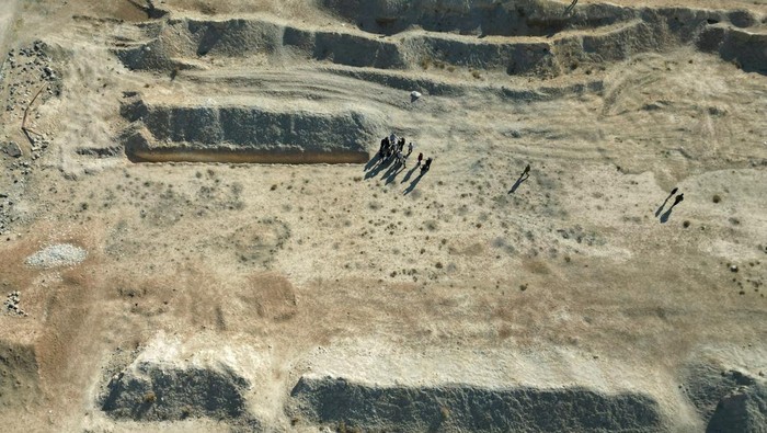 Bones are seen at the site of a mass grave from the rule of Syria's Bashar al-Assad, according to residents, after the ousting of al-Assad, in Najha, Syria, December 17, 2024. REUTERS/Ammar Awad