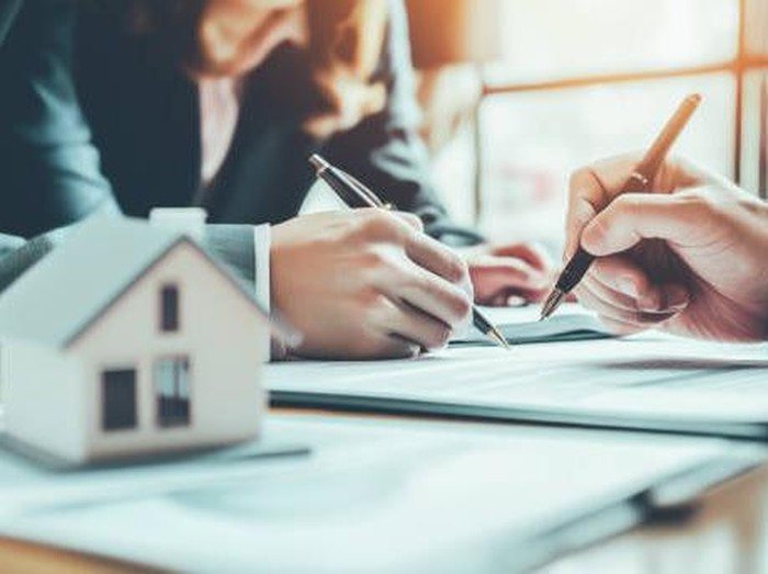 Business Signing a Contract Buy - sell house.