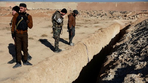 A drone view shows the site of a mass grave from the rule of Syrias Bashar al-Assad, according to residents, after the ousting of al-Assad, in Najha, Syria, December 17, 2024. REUTERS/Ammar Awad