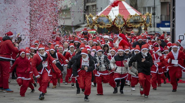 Thousands of Kosovars donned their festive attire for the annual Christmas theme charity run of Santas flooding the streets of Kosovo's capital on Sunday, Dec 15, 2024. The annual tradition seeks to gather funds for families in need. (AP Photo/Visar Kryeziu)