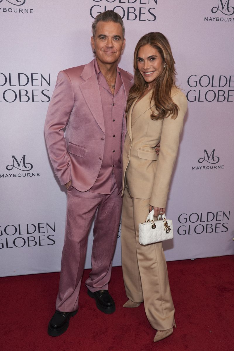 Robbie Williams, left, and Ayda Field Williams arrive at the Golden Globes first-time nominee celebration on Tuesday, Dec. 17, 2024, at The Maybourne Beverly Hills in Beverly Hills, Calif. (AP Photo/Chris Pizzello)