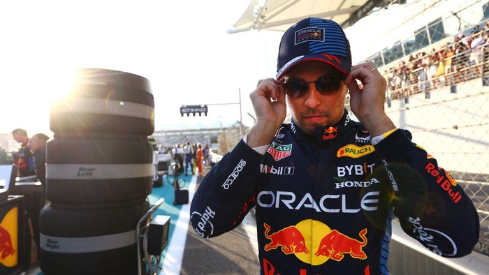 ABU DHABI, UNITED ARAB EMIRATES - DECEMBER 08: Sergio Perez of Mexico and Oracle Red Bull Racing prepares to drive on the grid during the F1 Grand Prix of Abu Dhabi at Yas Marina Circuit on December 08, 2024 in Abu Dhabi, United Arab Emirates. (Photo by Mark Thompson/Getty Images)