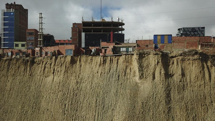 Aymara Indigenous spiritual workers' workplaces stand on the edge of a cliff overlooking La Paz, in El Alto, Bolivia, Tuesday, Dec. 17, 2024. (AP Photo/Gaston Brito)