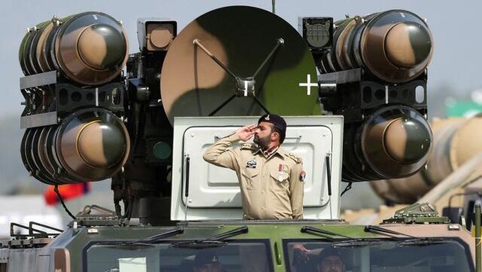 Pakistani Army soldier salutes while standing on an air defence missile system during Pakistan Day military parade in Islamabad, Pakistan, March 23, 2022. REUTERS/Saiyna Bashir/File Photo Purchase Licensing Rights