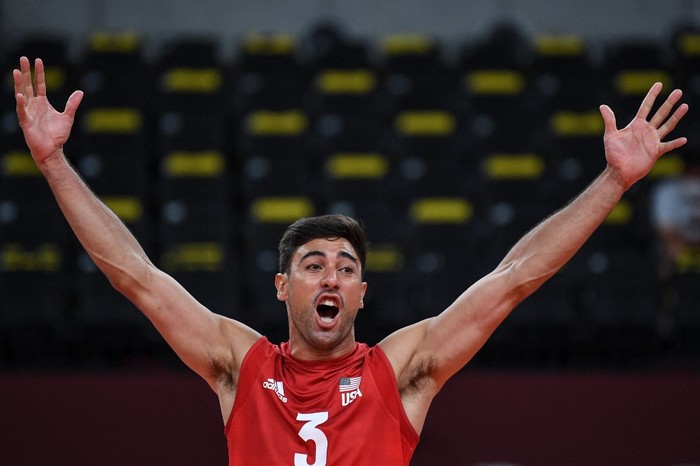 USAs Taylor Sander reacts after a point in the mens preliminary round pool B volleyball match between USA and France during the Tokyo 2020 Olympic Games at Ariake Arena in Tokyo on July 24, 2021. (Photo by Yuri Cortez / AFP)