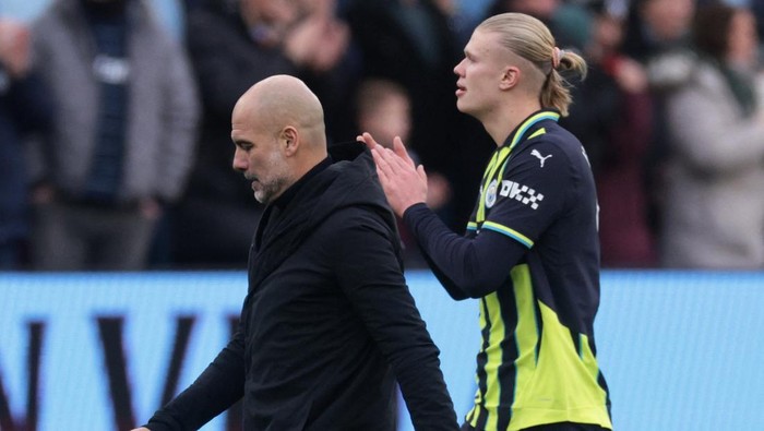 Soccer Football - Premier League - Aston Villa v Manchester City - Villa Park, Birmingham, Britain - December 21, 2024 Manchester City manager Pep Guardiola and Erling Haaland look dejected after the match REUTERS/Hannah Mckay EDITORIAL USE ONLY. NO USE WITH UNAUTHORIZED AUDIO, VIDEO, DATA, FIXTURE LISTS, CLUB/LEAGUE LOGOS OR LIVE SERVICES. ONLINE IN-MATCH USE LIMITED TO 120 IMAGES, NO VIDEO EMULATION. NO USE IN BETTING, GAMES OR SINGLE CLUB/LEAGUE/PLAYER PUBLICATIONS. PLEASE CONTACT YOUR ACCOUNT REPRESENTATIVE FOR FURTHER DETAILS..