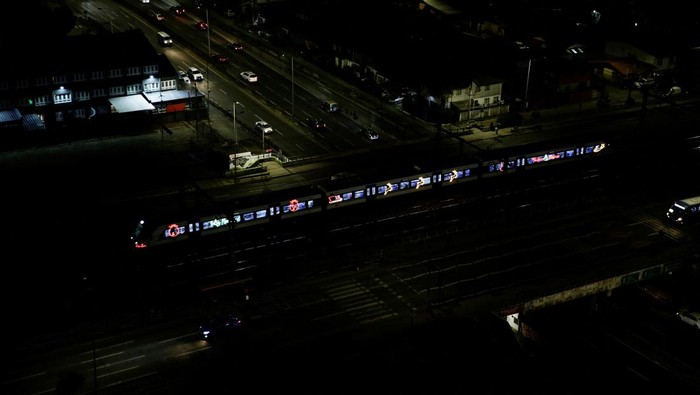 A Christmas train travels through the city, in Concepcion, Chile December 23, 2024. REUTERS/Juan Gonzalez
