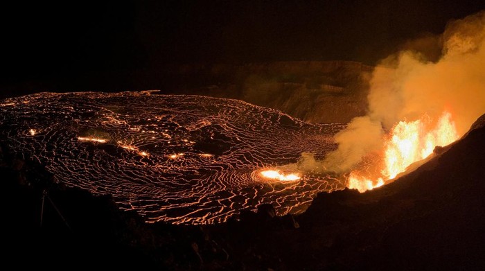 A lake of active lava in the summit caldera glows as the sun rises during a new eruption at Kilauea volcano in Hawaii, U.S. December 23, 2024.  USGS/N. Deligne/Handout via REUTERS.  THIS IMAGE HAS BEEN SUPPLIED BY A THIRD PARTY