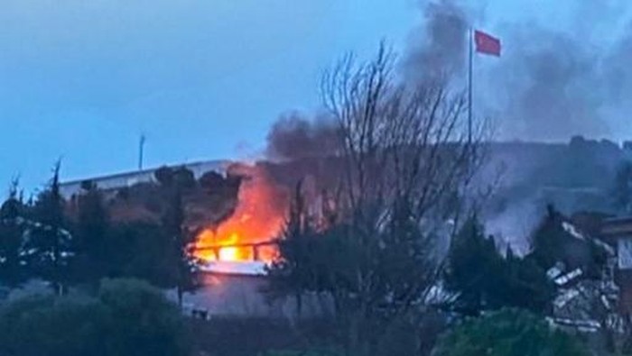 This handout image released by the Demiroren News Agency (DHA) on December 24, 2024, shows the moment of an explosion in Balikesir. A powerful blast on December 24, 2024, ripped through an explosives plant in northwest Turkey killing 12 people and injuring four others, officials said. Footage showed shards of glass and metal scattered outside the plant, where ambulances stood by. The plant, located in the north of Balikesir, makes munitions and explosives and flares for the domestic and international markets. (Photo by DHA (Demiroren News Agency) / AFP) / - Turkey OUT / RESTRICTED TO EDITORIAL USE - MANDATORY CREDIT AFP PHOTO / DHA (Demiroren News Agency)  - NO MARKETING - NO ADVERTISING CAMPAIGNS - DISTRIBUTED AS A SERVICE TO CLIENTS