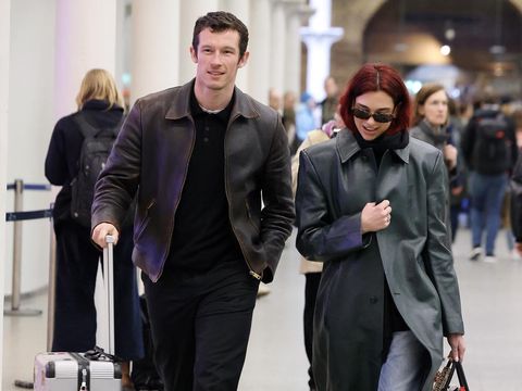 LONDON, ENGLAND - MARCH 26: Dua Lipa and Callum Turner arriving at London St Pancras Station after taking the Eurostar from Paris on March 26, 2024 in London, England. (Photo by Neil Mockford/GC Images)