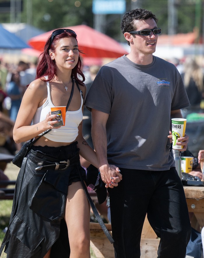 GLASTONBURY, ENGLAND - JUNE 29: Dua Lipa and Callum Turner during day four of Glastonbury Festival 2024 at Worthy Farm, Pilton on June 29, 2024 in Glastonbury, England. Founded by Michael Eavis in 1970, Glastonbury Festival features around 3,000 performances across over 80 stages. Renowned for its vibrant atmosphere and iconic Pyramid Stage, the festival offers a diverse lineup of music and arts, embodying a spirit of community, creativity, and environmental consciousness. (Photo by Samir Hussein/WireImage)