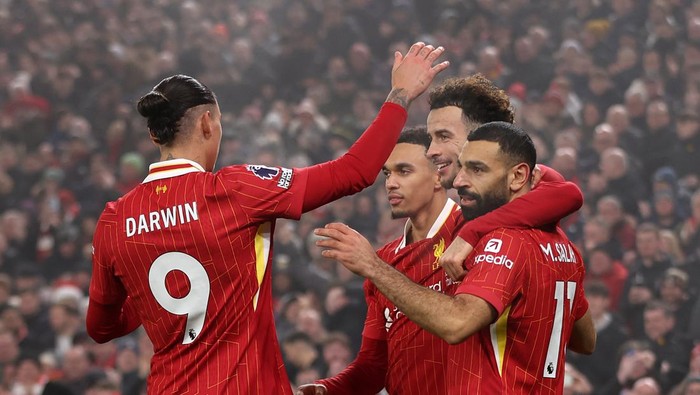 LIVERPOOL, ENGLAND - DECEMBER 26: Curtis Jones celebrates scoring the teams second goal during the Premier League match between Liverpool FC and Leicester City FC at Anfield on December 26, 2024 in Liverpool, England. (Photo by Copa/Getty Images)