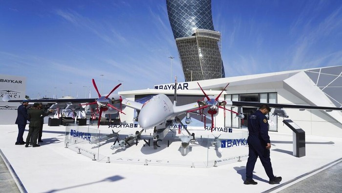 A drone made by Turkish manufacturer Baykar is seen at the International Defense Exhibition and Conference in Abu Dhabi, United Arab Emirates, Monday, Feb. 20, 2023. Just outside of Abu Dhabis biennial arms fair in a large tent, Russia offered weapons for sale Monday ranging from Kalashnikov assault rifles to missile systems despite facing sanctions from the West over its war on Ukraine. (AP Photo/Jon Gambrell)