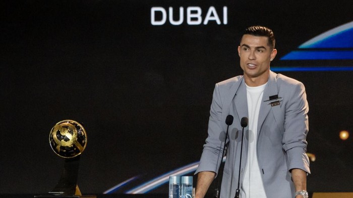 DUBAI, UNITED ARAB EMIRATES - DECEMBER 27: Cristiano Ronaldo of Al-Nassr gives a speech with his award during the Globe Soccer Dubai Awards 2024 as a part of the Dubai International Sports Conference 2024 in Dubai, United Arab Emirates (UAE) on December 27, 2024. (Photo by Waleed Zein/Anadolu via Getty Images)
