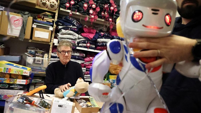Retired aviation technician, Guido Pacelli, also known as 'Rome's 'Geppetto' works on a broken toy to be fixed and given to underprivileged and sick children in Rome, Italy, December 19, 2024. REUTERS/Antonio Denti