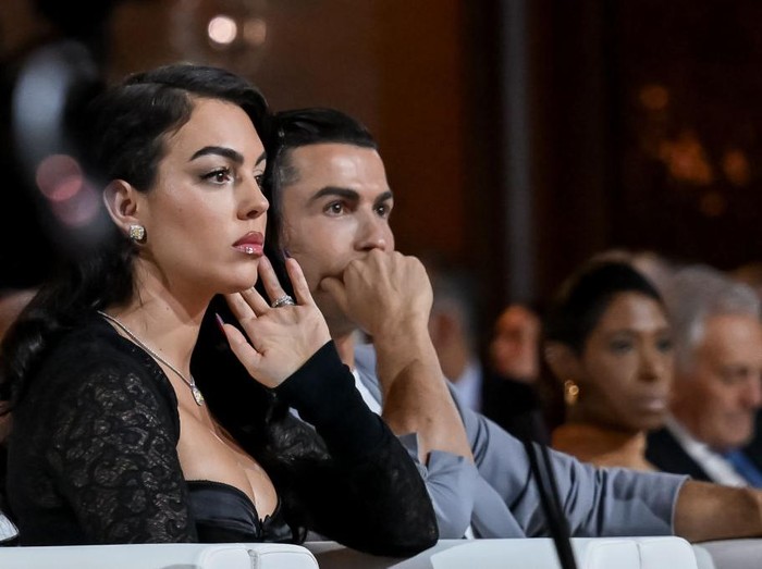 DUBAI, UNITED ARAB EMIRATES - DECEMBER 27: Al-Nassr player Cristiano Ronaldo (2nd L) and Georgina Rodriguez (L) attend the Globe Soccer Dubai Awards 2024 as part of the Dubai International Sports Conference 2024 in Dubai, United Arab Emirates (UAE) on December 27, 2024. (Photo by Waleed Zein/Anadolu via Getty Images)