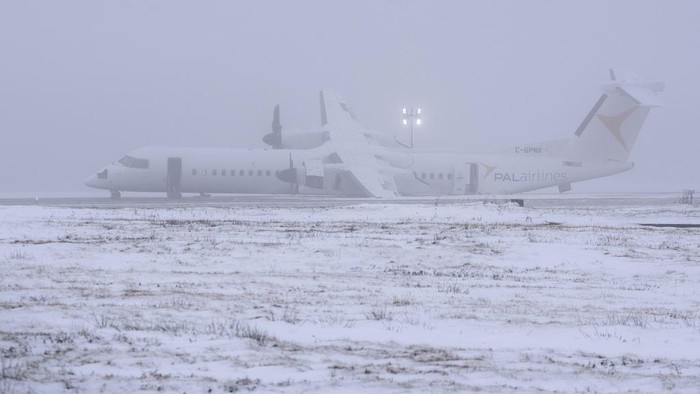 An Air Canada Express flight operated by Pal Airlines skidded off the runway Saturday night after catching fire at Halifax Stanfield International Airport is seen on Sunday, Dec. 29, 2024, in Halifax, Nova Scotia. (Darren Calabrese/The Canadian Press via AP)
