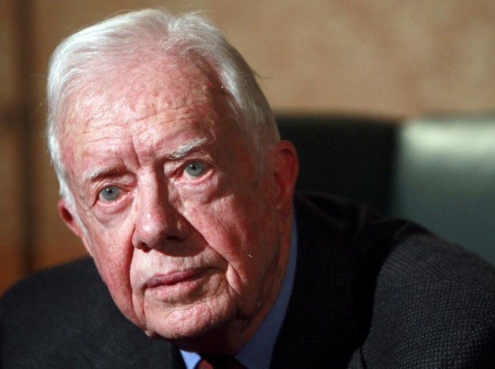 FILE PHOTO: Former U.S. President Jimmy Carter gestures during an interview with Reuters in Cairo January 12, 2012.  REUTERS/Amr Abdallah Dalsh/File Photo