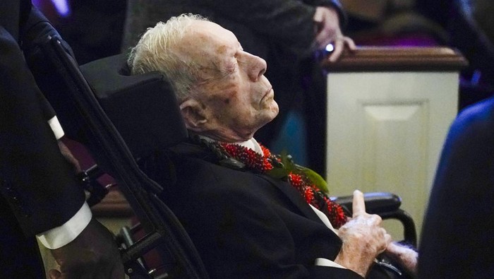 PLAINS, GA - NOVEMBER 29: Former President Jimmy Carter departs after the funeral service for former first lady Rosalynn Carter at Maranatha Baptist Church on November 29, 2023, in Plains, Georgia. Rosalynn Carter, who passed away on November 19 at the age of 96, was married to former U.S. President Jimmy Carter for 77 years. In her lifetime she was an activist and writer known to be an advocate for the elderly, affordable housing, mental health, and the protection of monarch butterflies. (Photo by Alex Brandon - Pool/Getty Images)