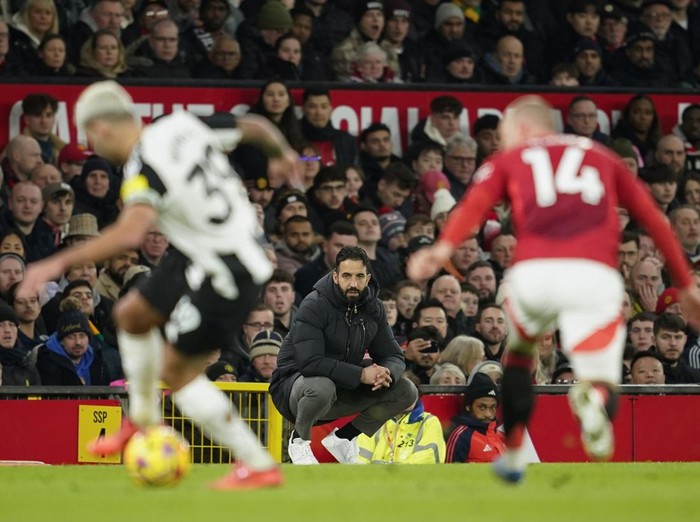 Manchester Uniteds head coach Ruben Amorim, center, reacts during the English Premier League soccer match between Manchester United and Newcastle at the Old Trafford stadium in Manchester, England, Monday, Dec. 30, 2024. (AP Photo/Dave Thompson)
