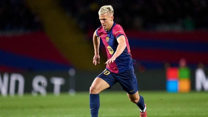 BARCELONA, SPAIN - DECEMBER 21: Dani Olmo of FC Barcelona runs with the ball during the LaLiga EASports match between FC Barcelona and Atletico de Madrid at Estadi Olimpic Lluis Companys on December 21, 2024 in Barcelona, Spain. (Photo by Alex Caparros/Getty Images)