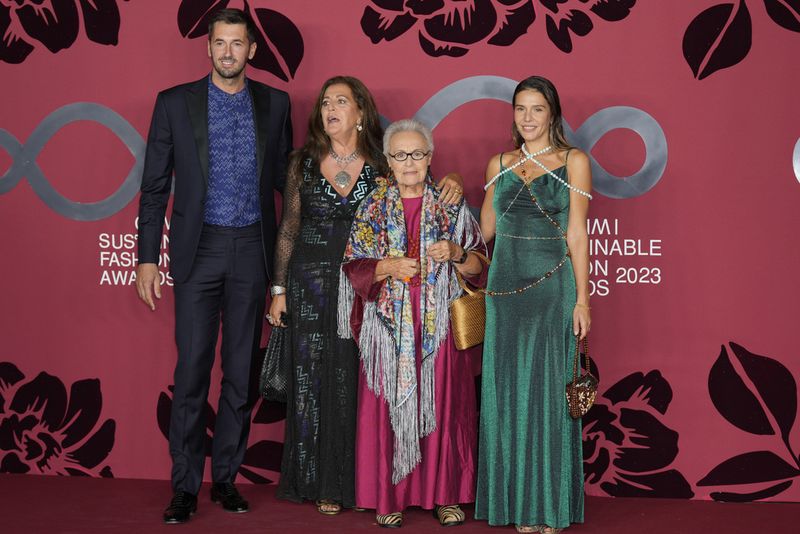 From left: Ottavio Missoni Jr., Angela Missoni, Rosita Missoni, Margherita Missoni pose for photographers as they arrive for the CNMI sustainable fashion 2023 awards in Milan, Italy, Sunday, Sept. 24, 2023. (AP Photo/Antonio Calanni)