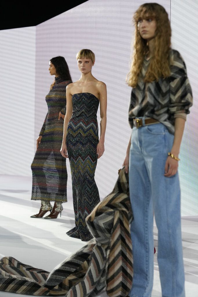 Models wear creations as part of the Missoni Fall/Winter 2022-2023 fashion collection, unveiled during the Fashion Week in Milan, Italy, Friday, Feb. 25, 2022. (AP Photo/Luca Bruno)