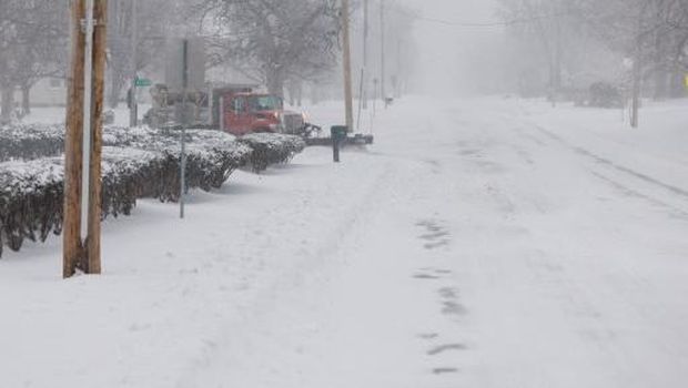 SHAWNEE, KANSAS - JANUARY 5: A salt and plow truck pushes snow to the side of a road on January 5, 2025 in Shawnee, Kansas. conditions have worsened since the morning hours with strong winds and low visibility. Snow drifts have grown and the sidewalks are difficult to walk on in the deep snow. A large swath of the U.S., across the Midwest to the East Coast is experiencing a major Winter storm, with more than two feet of snow in some areas. A state of emergency has been declared in Kentucky and Virginia. Chase Castor/Getty Images/AFP (Photo by Chase Castor / GETTY IMAGES NORTH AMERICA / Getty Images via AFP)