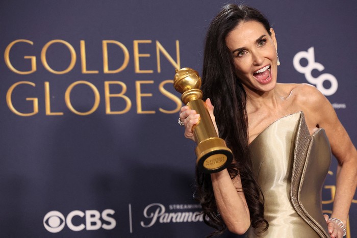 Demi Moore poses with the award for Best Performance by an Actress in a Motion Picture - Musical or Comedy, for The Substance, at the 82nd Golden Globe Awards in Beverly Hills, California, U.S., January 5, 2025. REUTERS/Mario Anzuoni     TPX IMAGES OF THE DAY