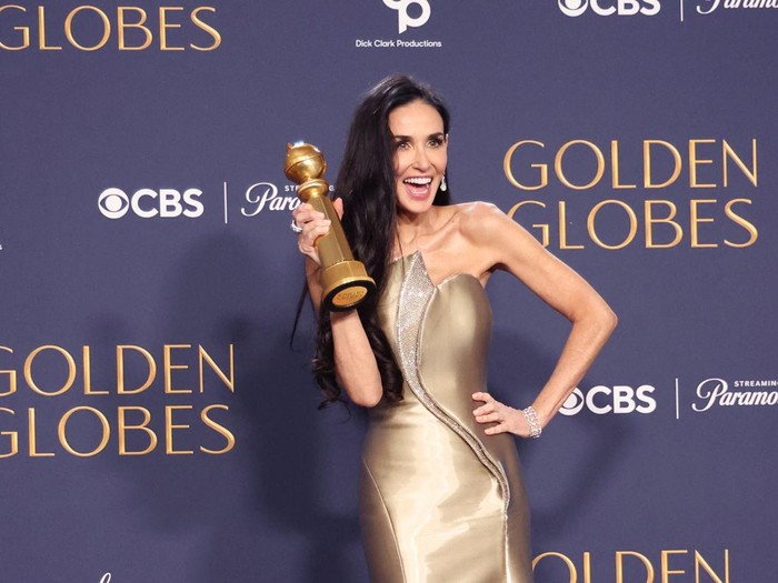 Demi Moore poses with the award for Best Performance by an Actress in a Motion Picture - Musical or Comedy, for The Substance, at the 82nd Golden Globe Awards in Beverly Hills, California, U.S., January 5, 2025. REUTERS/Mario Anzuoni     TPX IMAGES OF THE DAY
